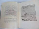 an open book with a drawing of a castle on it