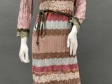 an image of a mannequin wearing a pink and brown dress