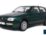 the green car is parked in front of a white background