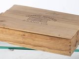 a wooden box that is sitting on a glass table