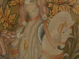 a picture of a tapestry with a woman riding a horse and a cat