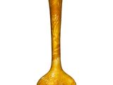 un vase jaune posé sur une surface blanche