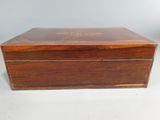 an old wooden box with two drawers on top of it