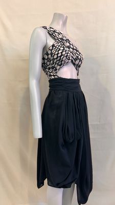the mannequin is wearing a black skirt and a cropped top