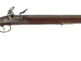 gros plan d'un fusil monté sur un mur