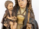 an image of a statue of a woman holding a child