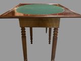 an image of a wooden table with a green top and legs