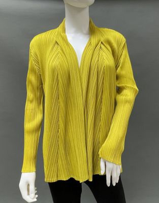 an image of a mannequin wearing a yellow sweater and black pants