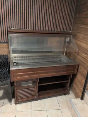 a display case with a glass top on the floor