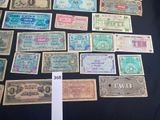 several different types of foreign currency are displayed on a table