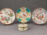 three chinese porcelain plates and a box on stands