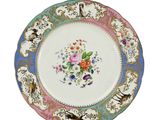 a plate with a floral design on it on a white background