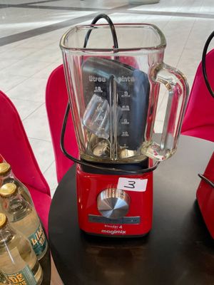 a blender that is sitting on a table in a room