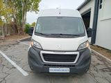 a white van that is parked in a parking lot