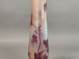 a glass vase with a floral design on it
