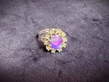 a close up of a purple ring on a purple surface