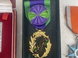 a box with a medal, a medal, and a medal on it