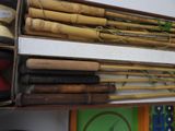 many different types of bamboo sticks on a shelf