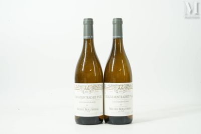 two bottles of wine sitting next to each other on a table