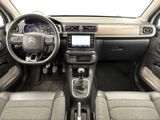 the interior of a car with a steering wheel, dashboard, and dashboard controls