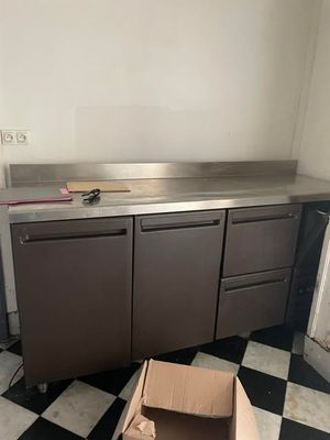 a box that is sitting on the floor next to a kitchen counter