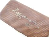 a brown case with writing on it sitting on a table