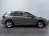 the grey honda civic is parked in a room with a gray wall