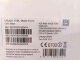 the back of a white cell phone with a barcode on it