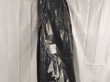 a black plastic bag on top of a white sheet