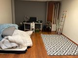 an image of a bedroom with a bed and a desk