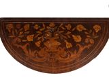 a wooden table with a floral design on it
