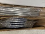 two boxes of plastic straws sitting on the floor