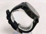 a close up of a watch on a clear stand
