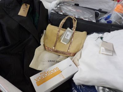 a suit case and a handbag sitting in a suitcase