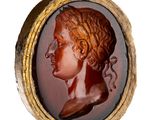a picture of a picture of a woman ' s head in a gold frame