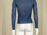 the back of a mannequin wearing a blue shirt and white pants
