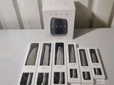 a box of knives and a knife sharper sitting on a table
