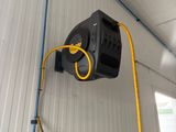 a hose attached to the wall of a garage