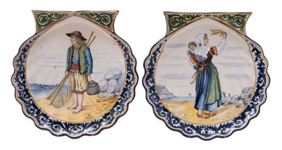 pair of decorative plates with figures on them on a white background