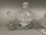 three glass items that are sitting on a table
