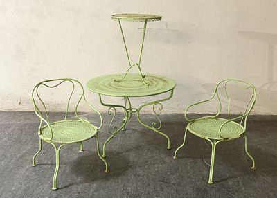 three chairs and a table on the concrete floor