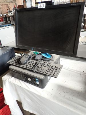 a computer on a table with a keyboard and a monitor