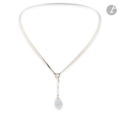 a close up of a necklace on a white background