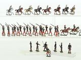 many figurines of soldiers on display in a display case