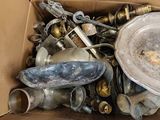 a cardboard box full of old items in it