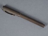 a pen that is laying on a table