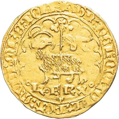 a close up of a gold coin with a bird on it