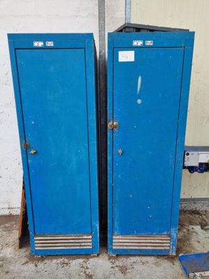 two blue lockers sitting next to each other in a room