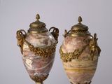 two vases that are sitting next to each other on a table
