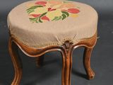 an image of a small stool with a floral design on it